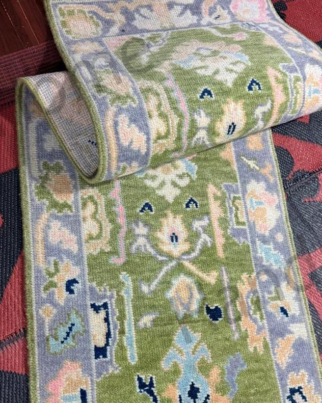Hand-knotted wool Oushak rug for hallways.