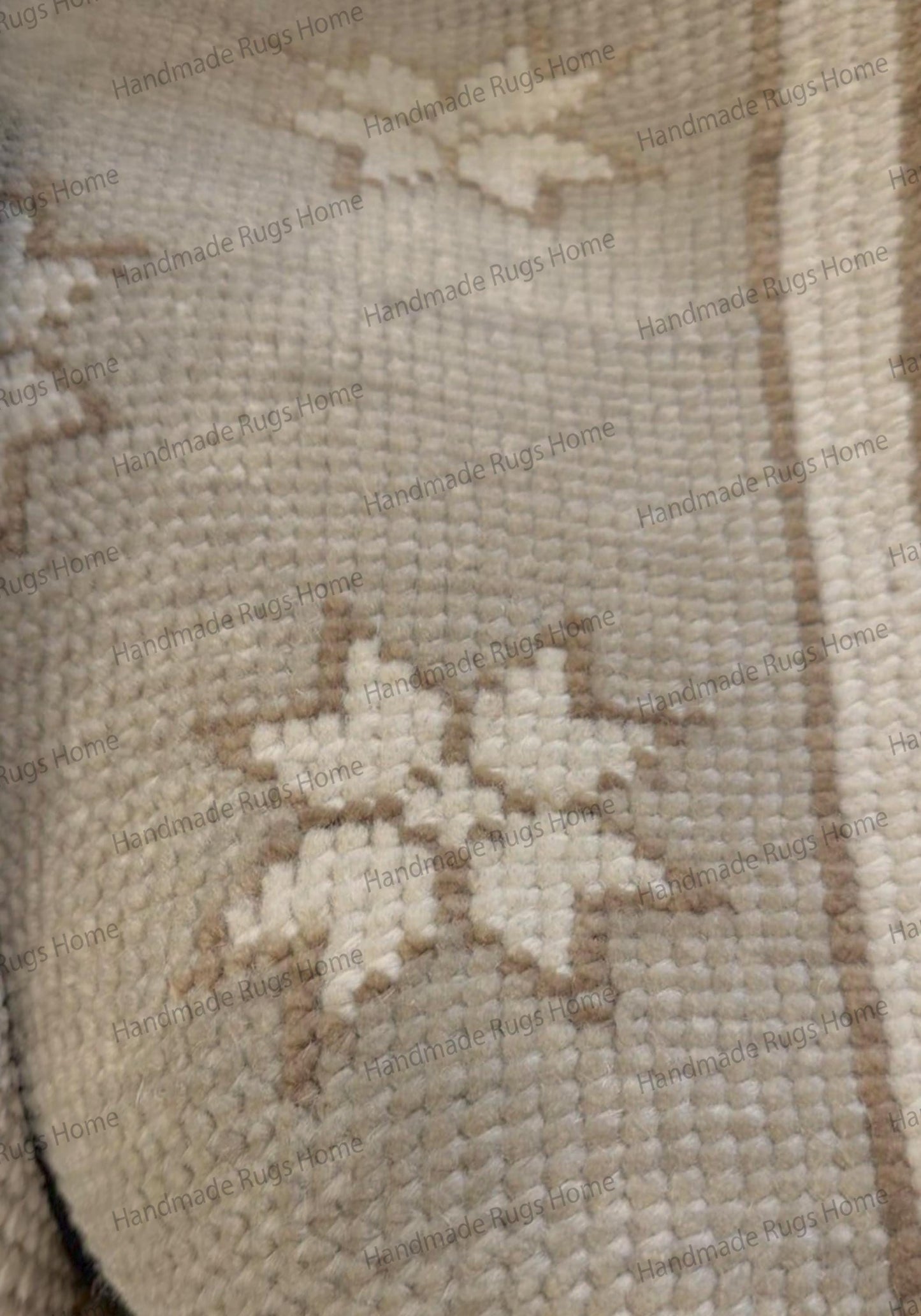 Detailed view of the tight knotting and low pile texture of a handmade star-patterned rug.