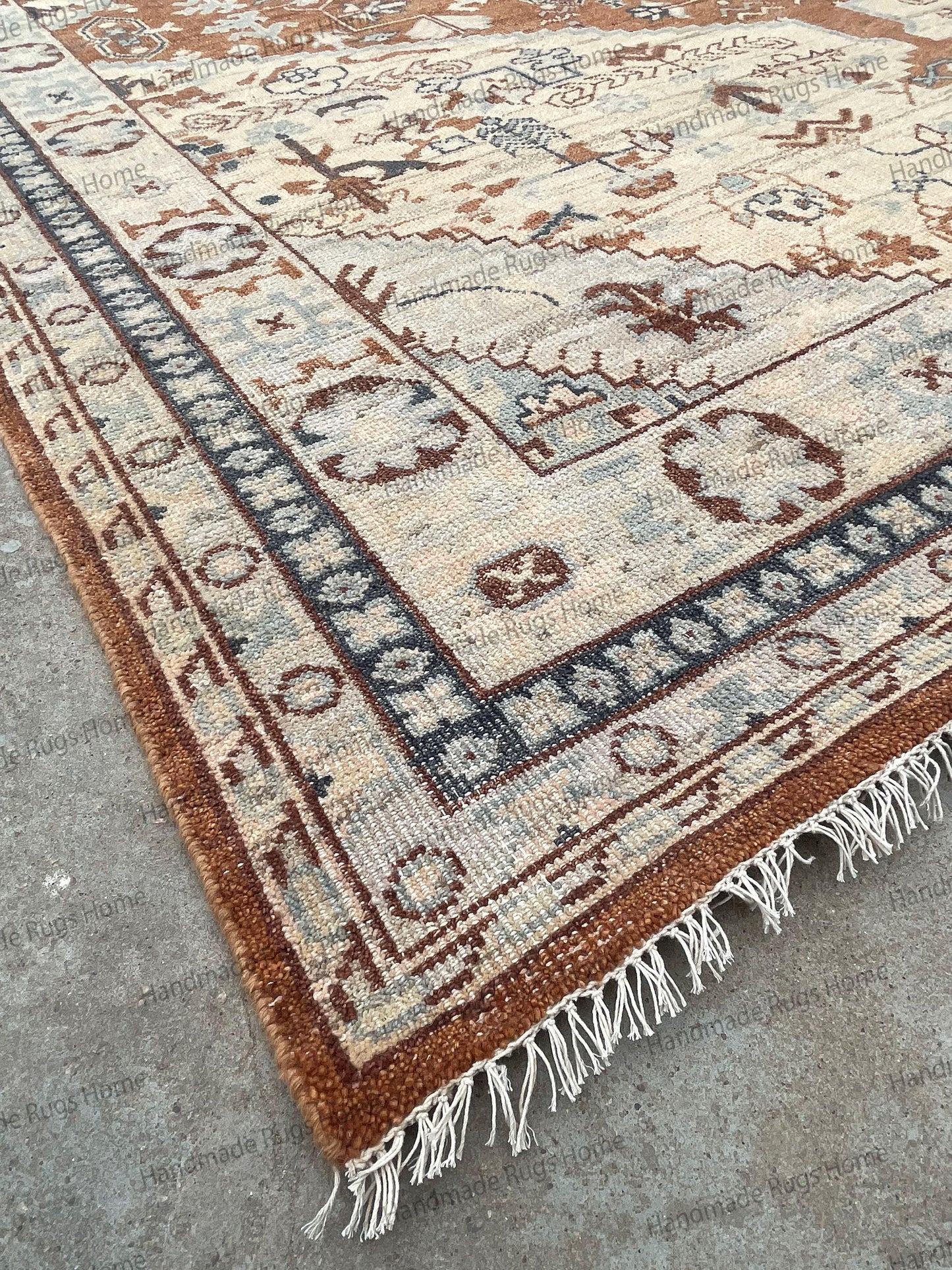 Elegant Anatolian style carpet with sage green and terracotta accents.