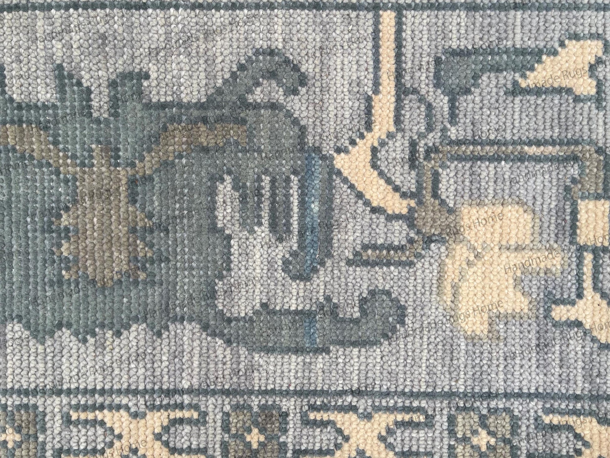 Elegant oriental wool rug featuring soft muted pastel colors