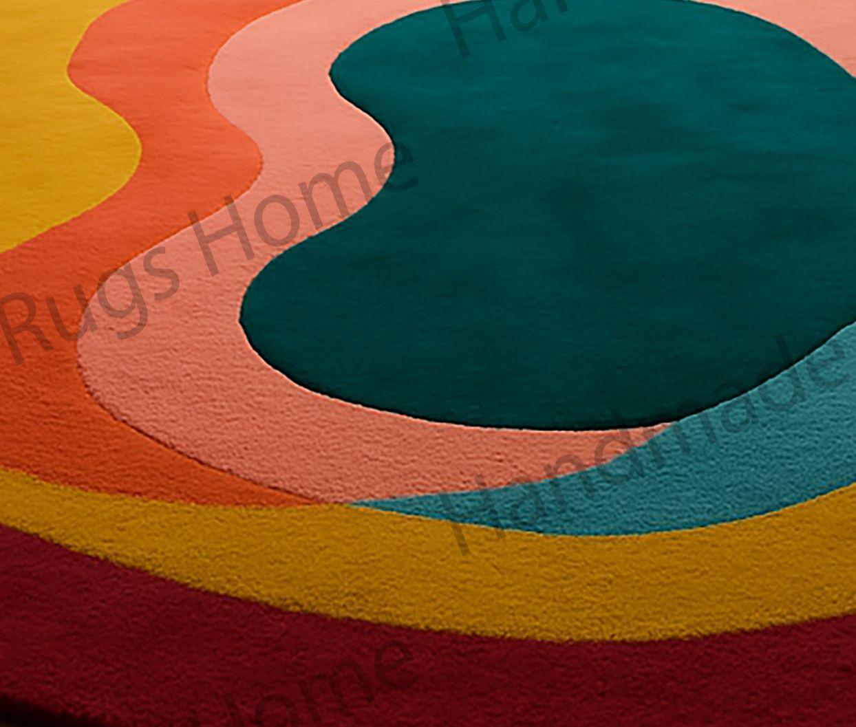 Hand-tufted wool rug with an organic abstract design in rich emerald green, peach, burnt orange, mustard yellow, and crimson red.