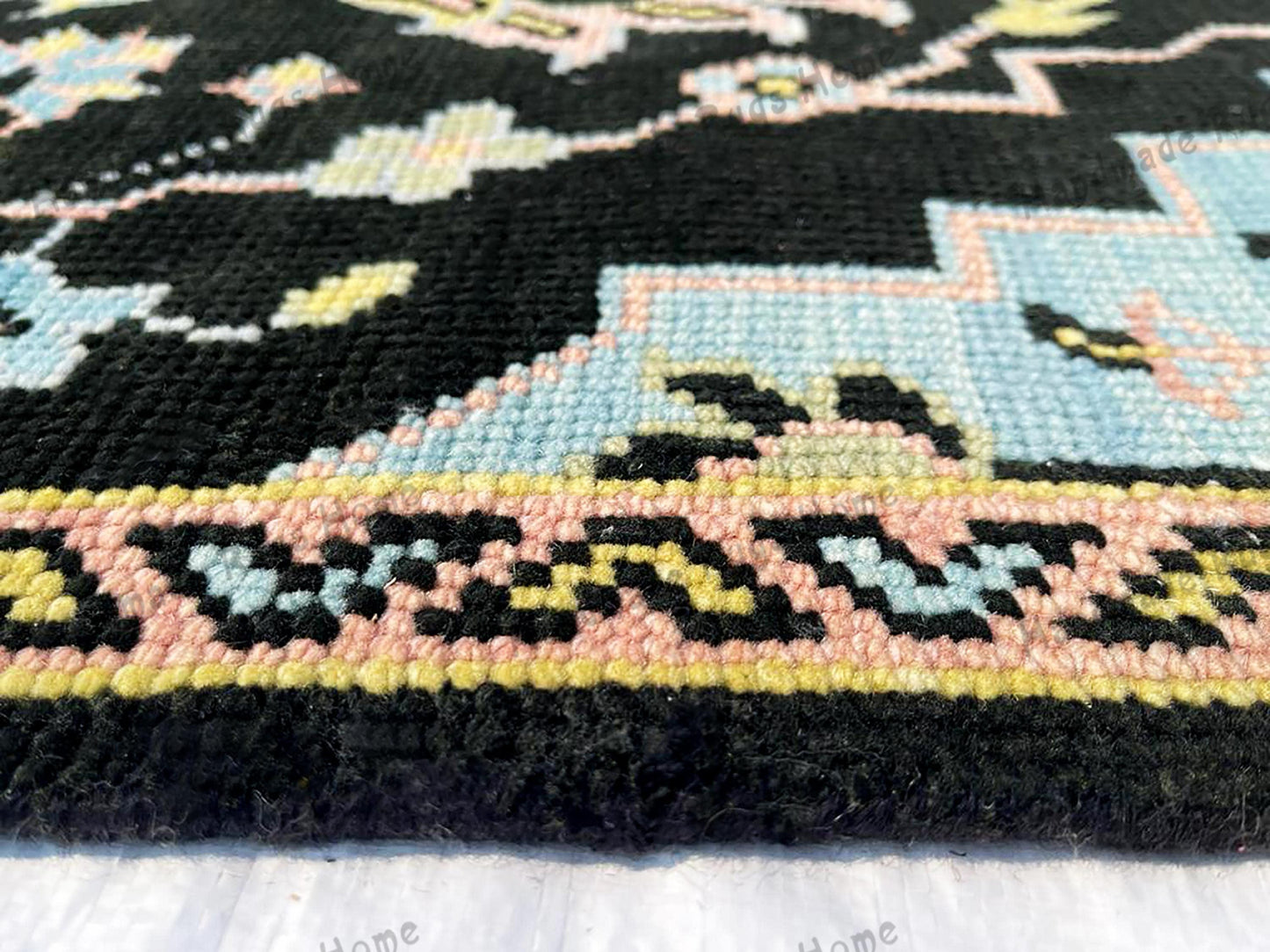 Distressed vintage-style runner rug in black and pastel hues
