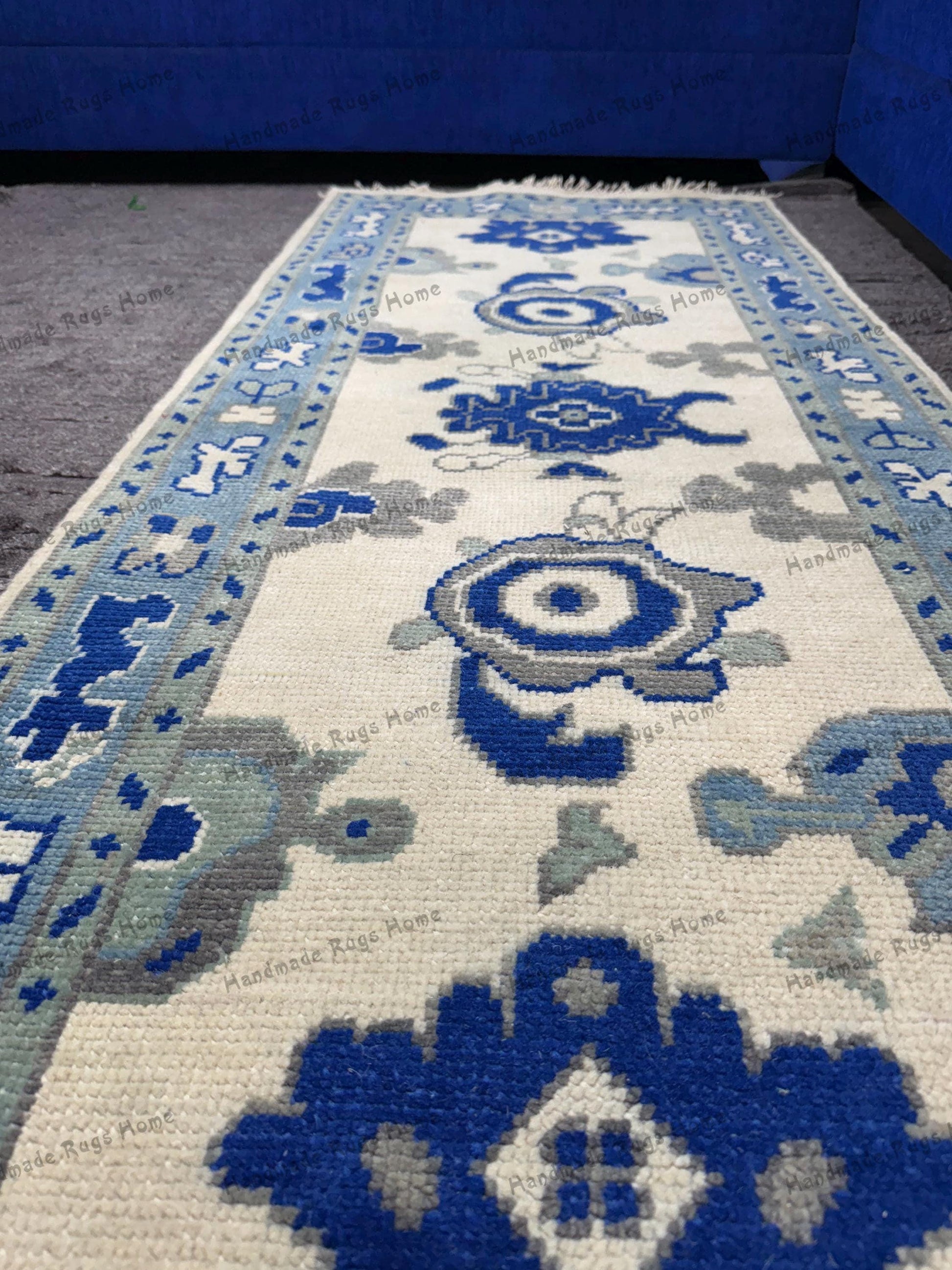 Blue Turkish-style handwoven rug for home decor.
