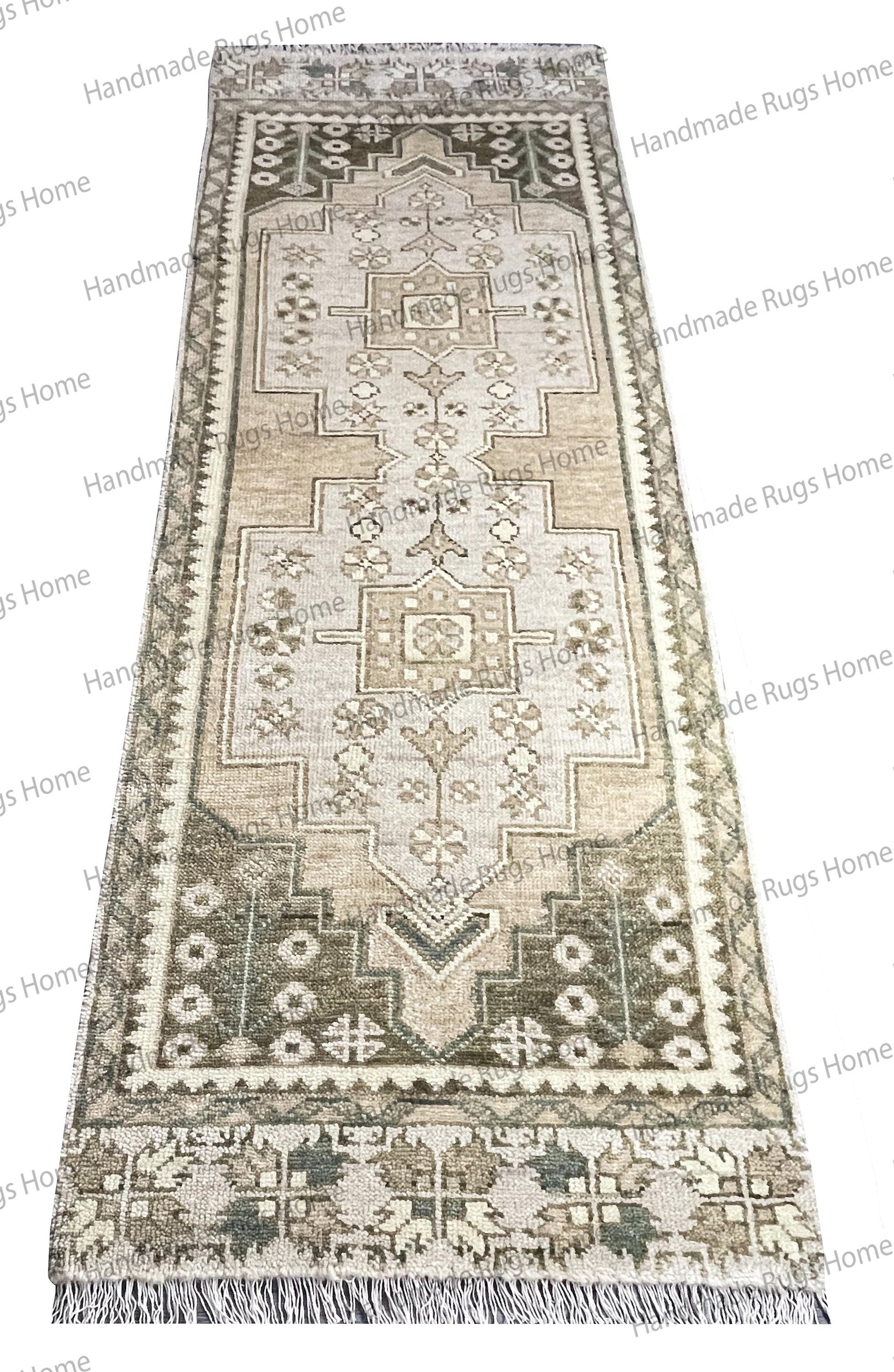 Full view of the beige and gray runner, showing the fringe and long, narrow shape.