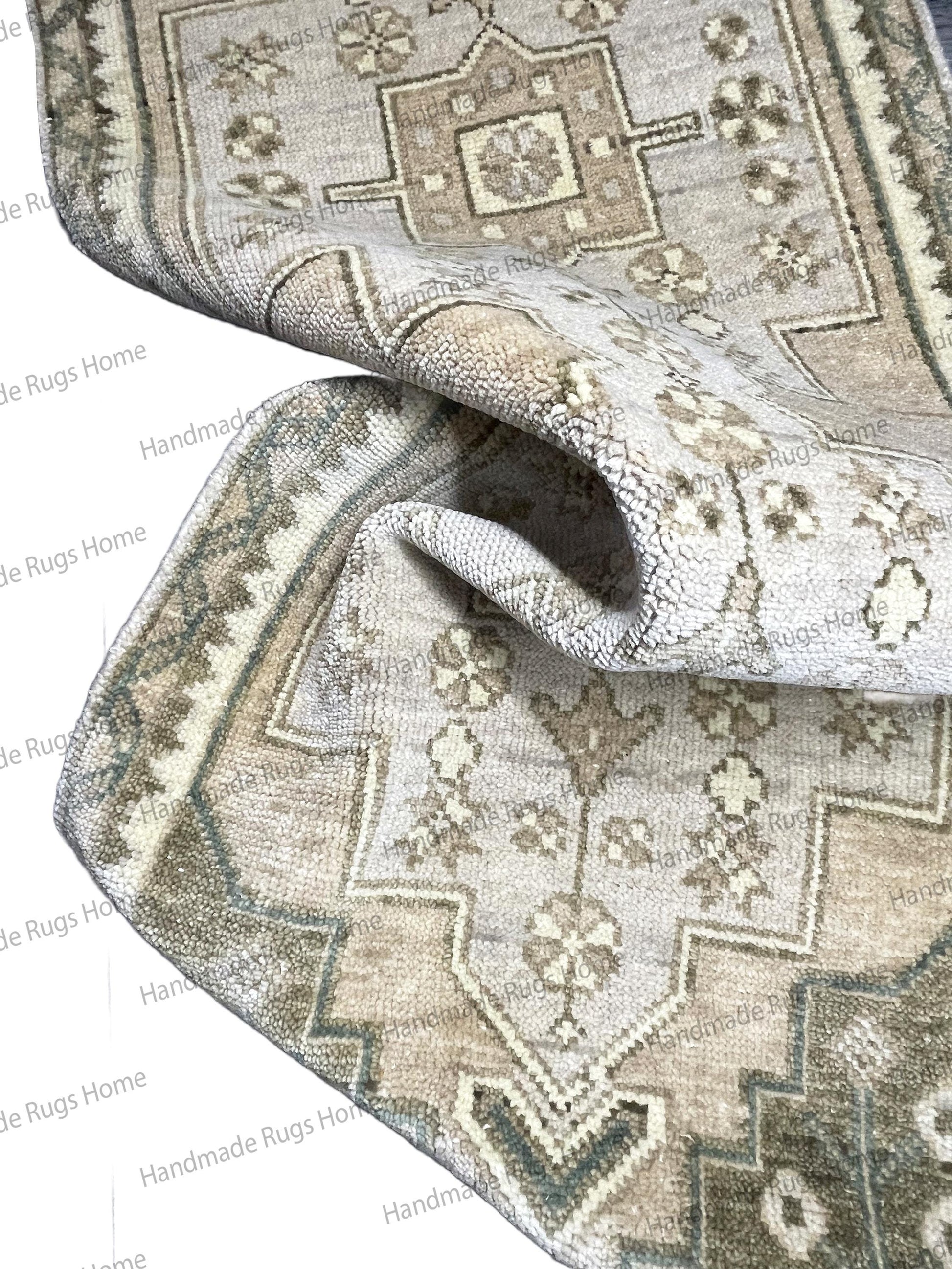 Hand-woven wool textile with a classic medallion design and low, dense pile.
