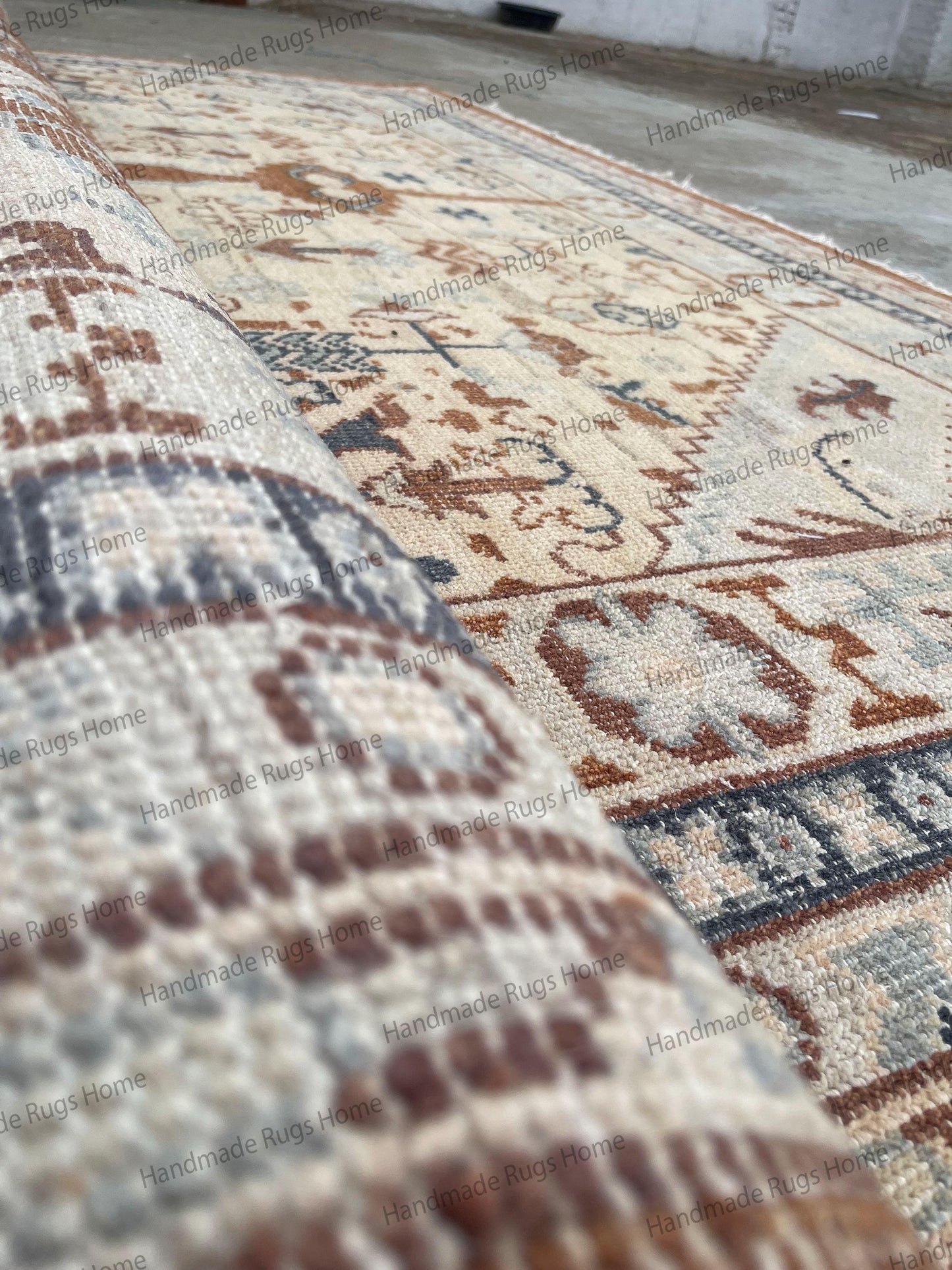 Vintage-style Oushak carpet with modern transitional color palette.
