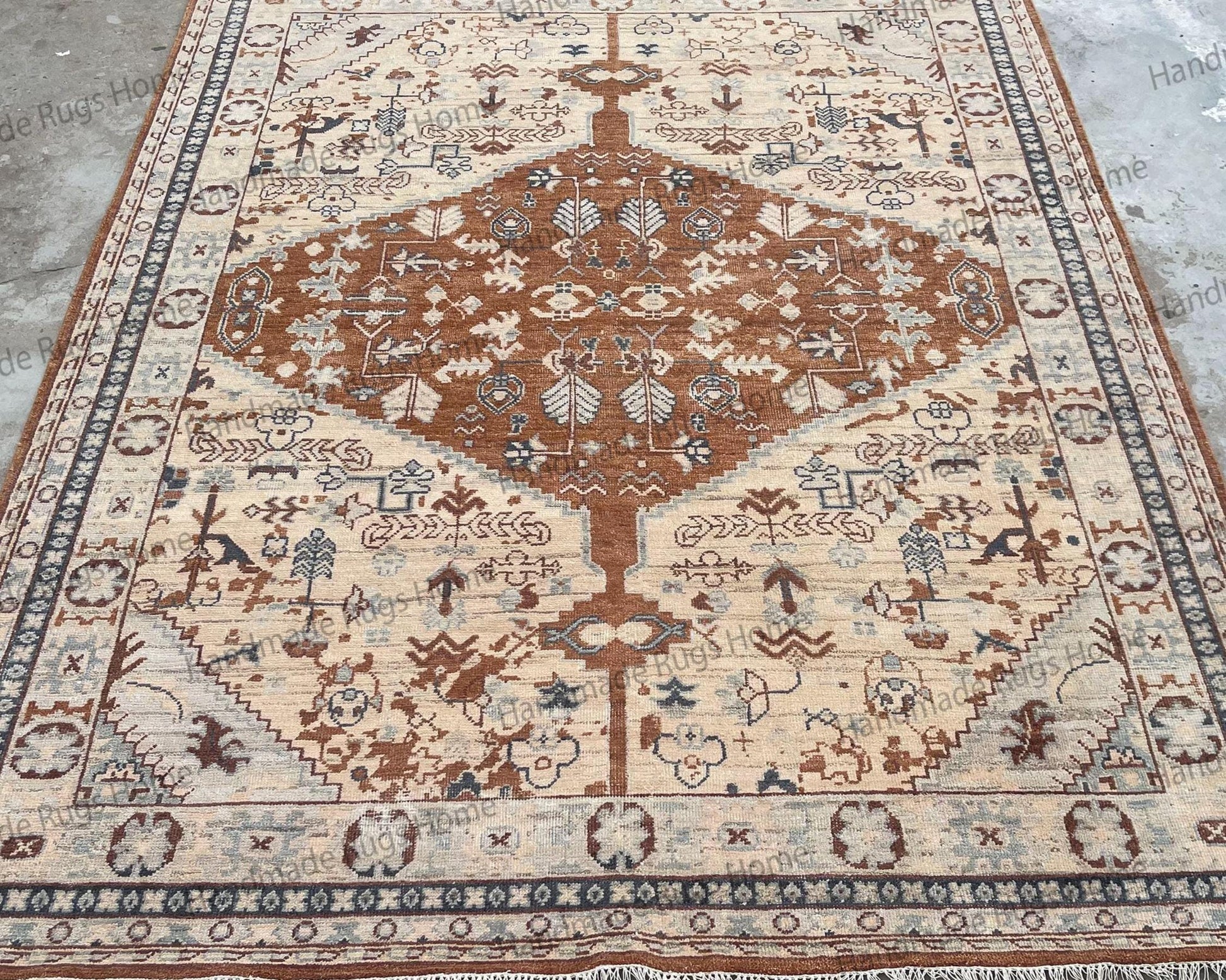 Oversize Oushak area rug in neutral and subtle blue shades.