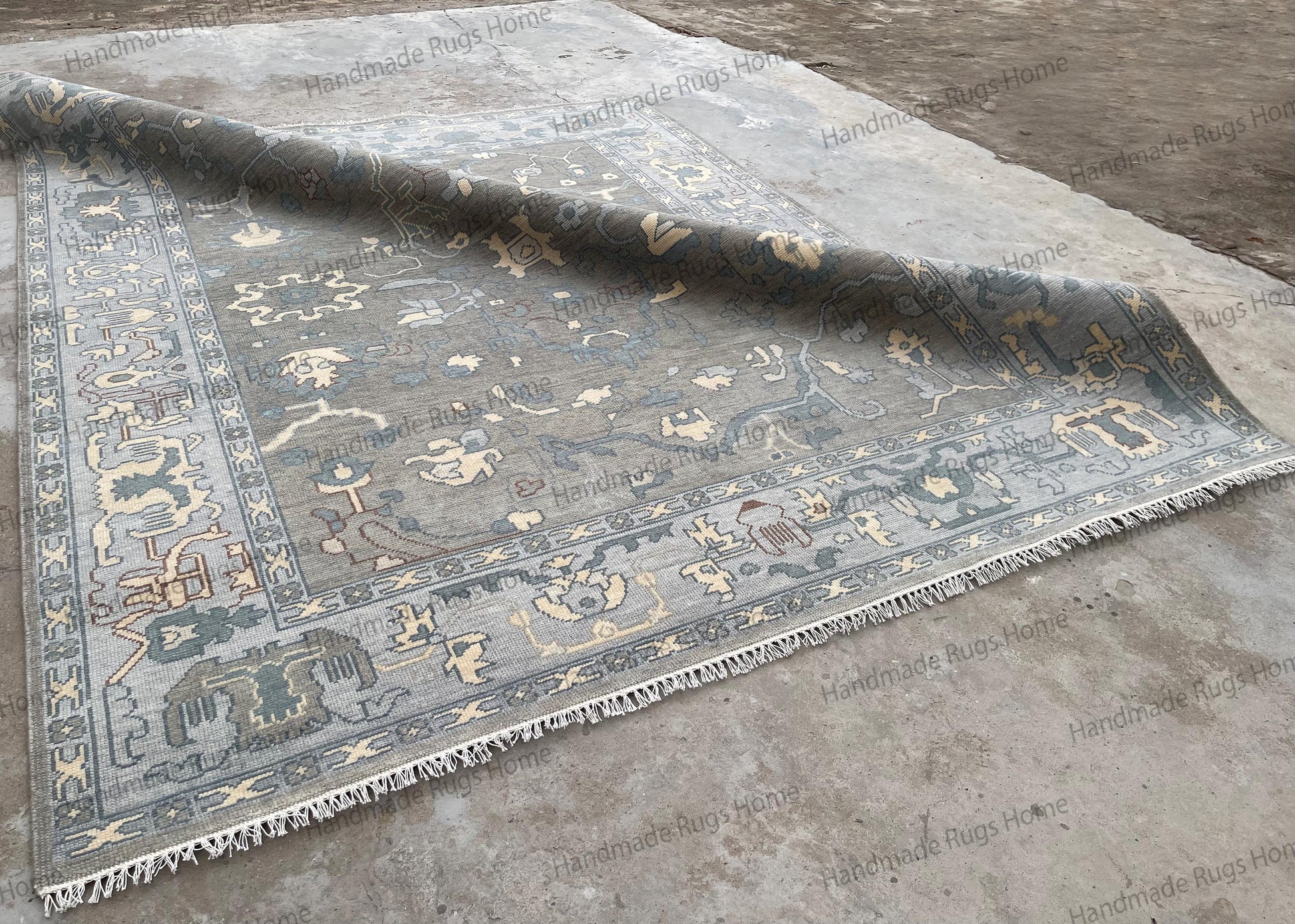 Luxury wool area rug with intricate blue and beige pattern