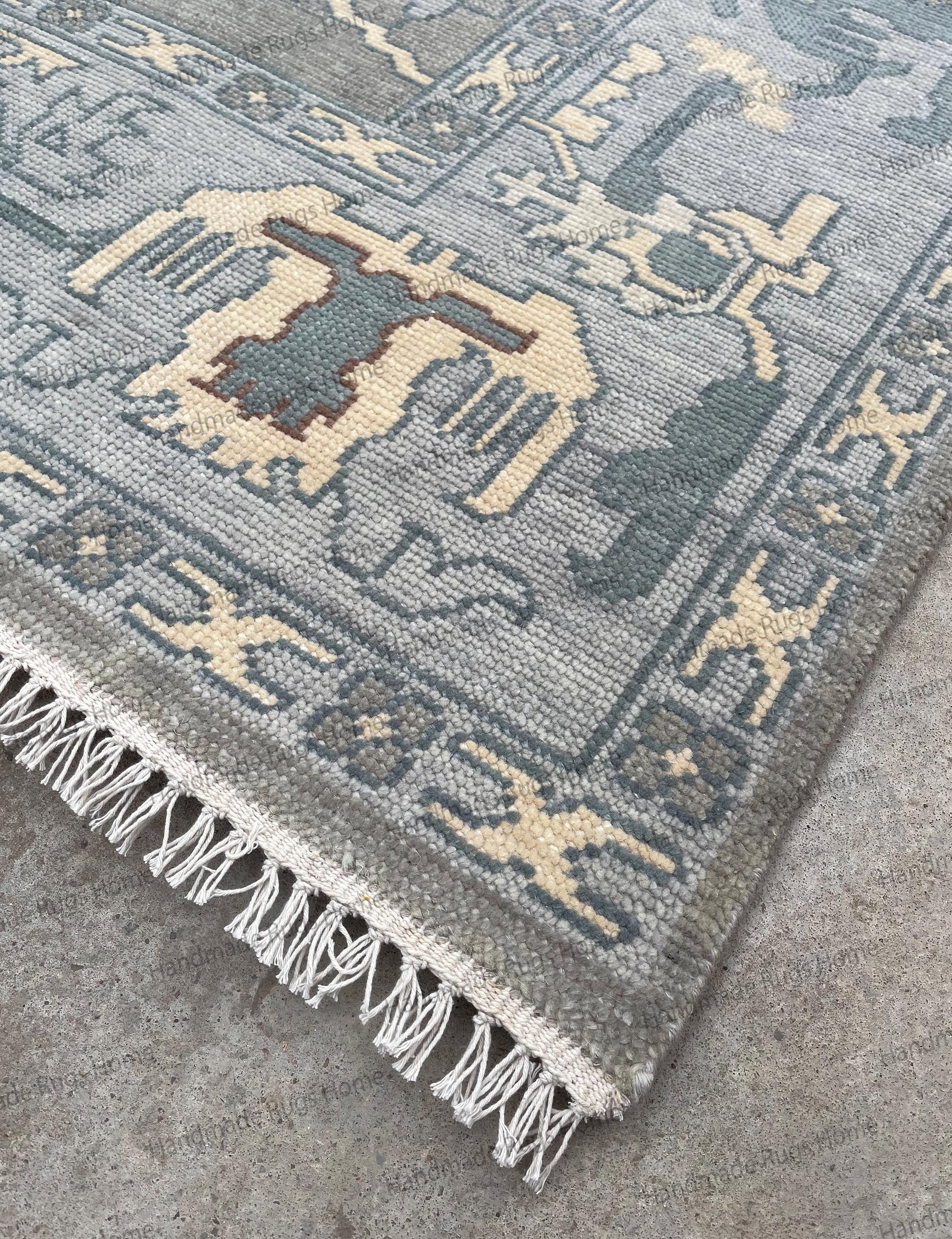 Handmade wool rug featuring Turkish inspired motifs and border