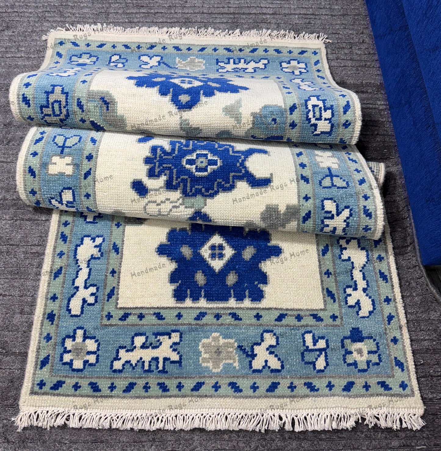 Modern blue runner rug with unique border patterns.