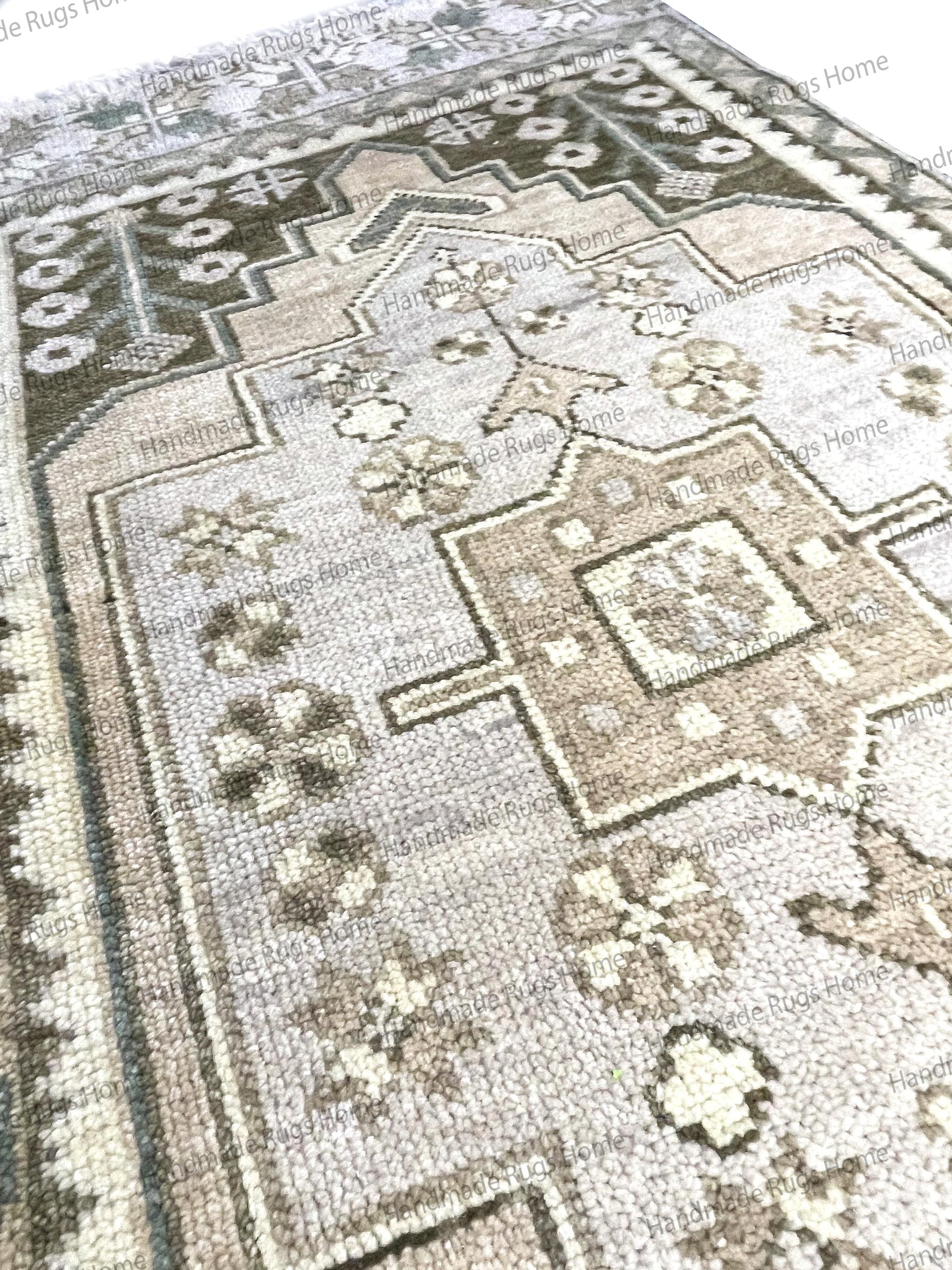Transitional style wool rug in natural, neutral colors, handmade for lasting quality.