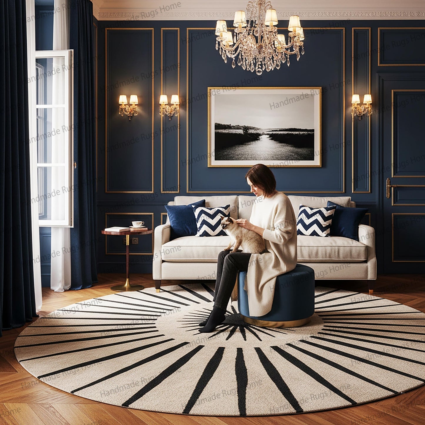 Round hand-tufted wool rug, ivory and black sunburst design.