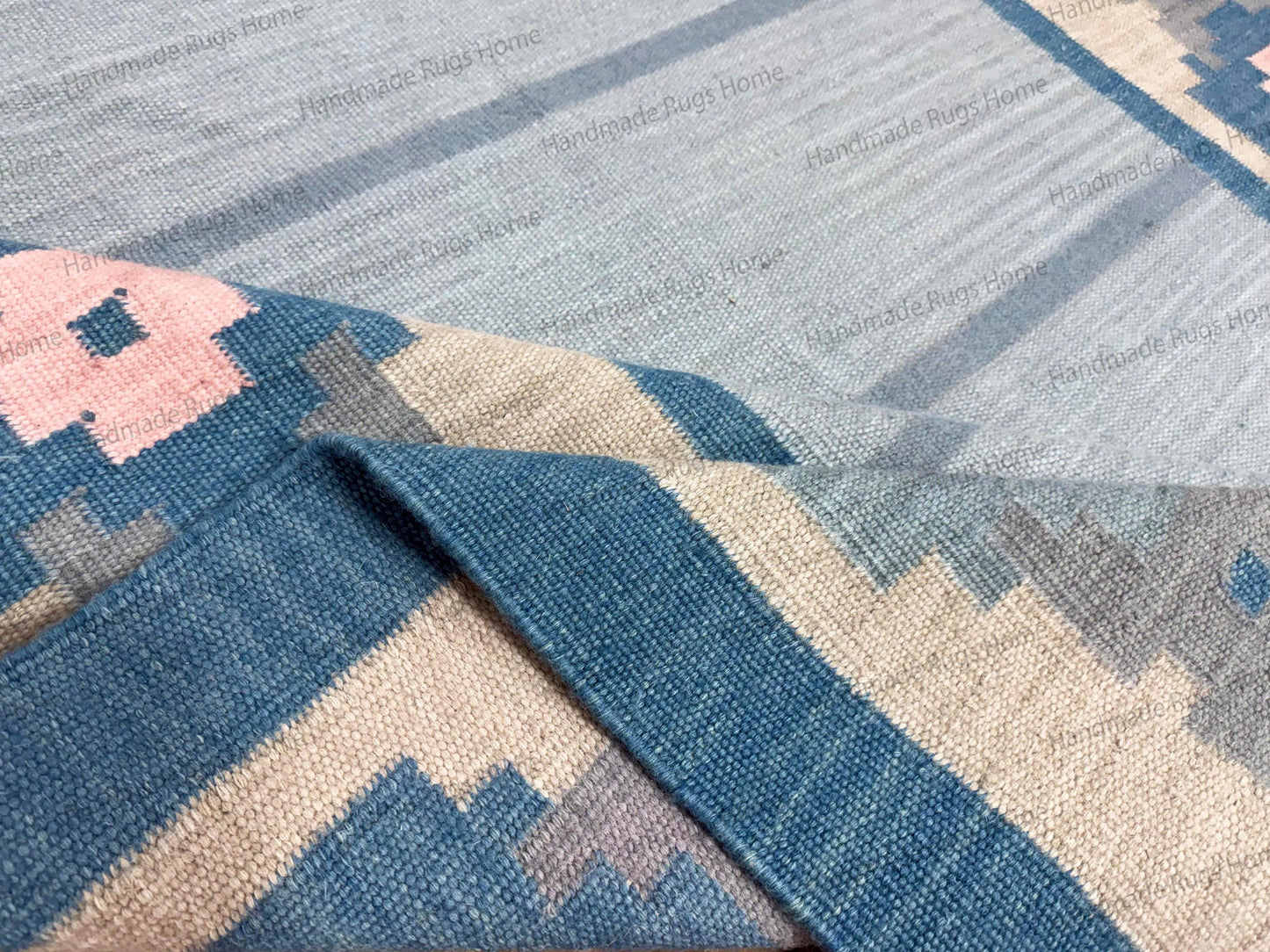 handloom indian durrie,

light blue wool floor covering