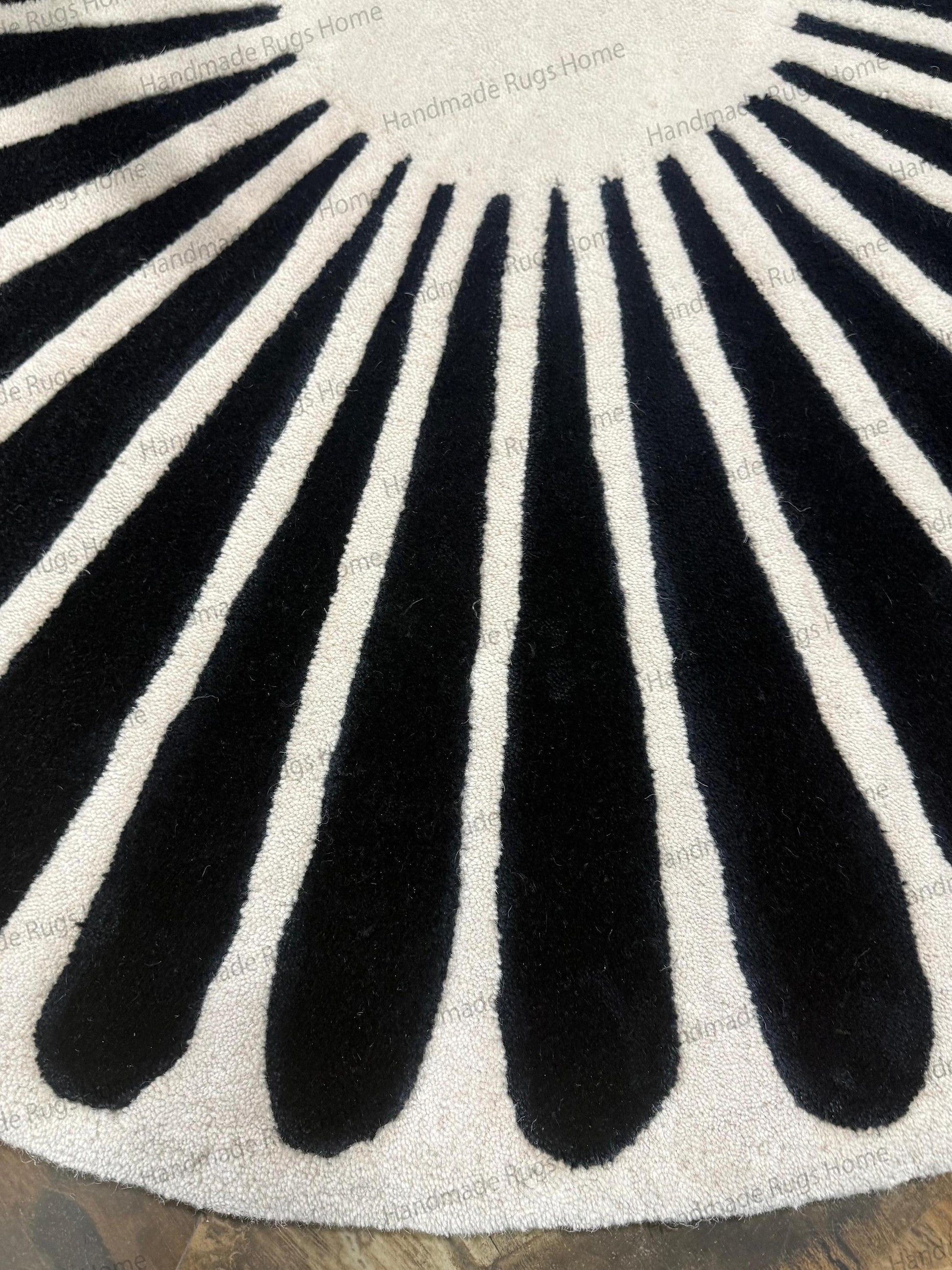 Scandi noir style wool mat for lounge area,

Geometric wheel pattern rug hand crafted,

Fashionable floor covering for boutique or office,

Soft underfoot bedroom rug black and white decor.