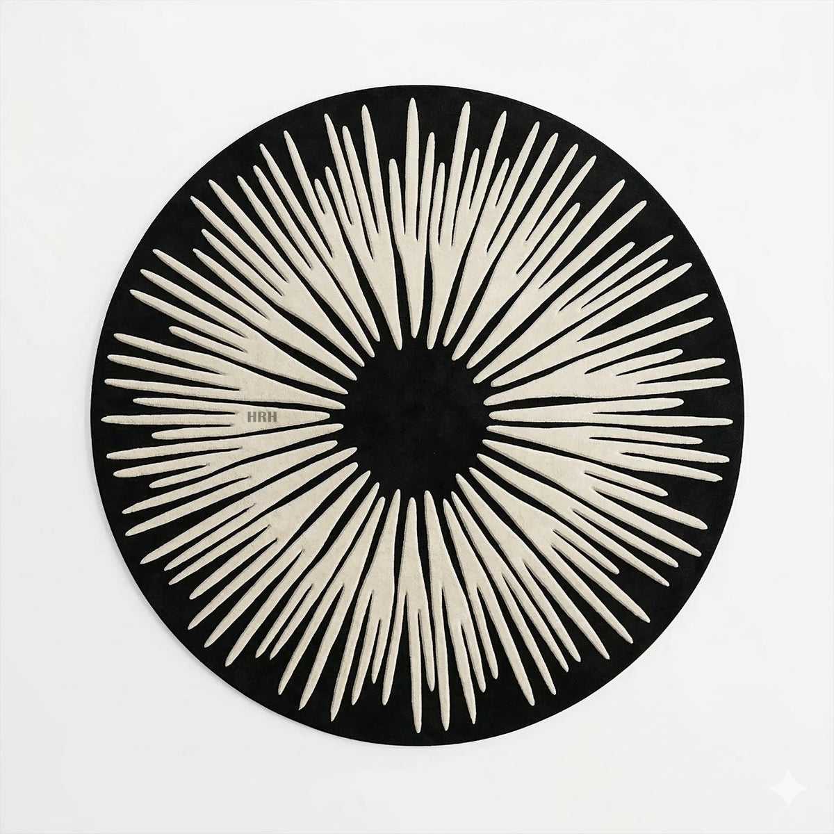 Plush handwoven floor decor in upscale contemporary lounge space.

Chic playroom setting showcasing a large statement centerpiece.

Thick pile artisanal rug displaying dramatic optical illusion design.

Black and cream radial spike pattern carpet for interior styling.

Elegant circular mat surrounded by four dark velvet chairs.
