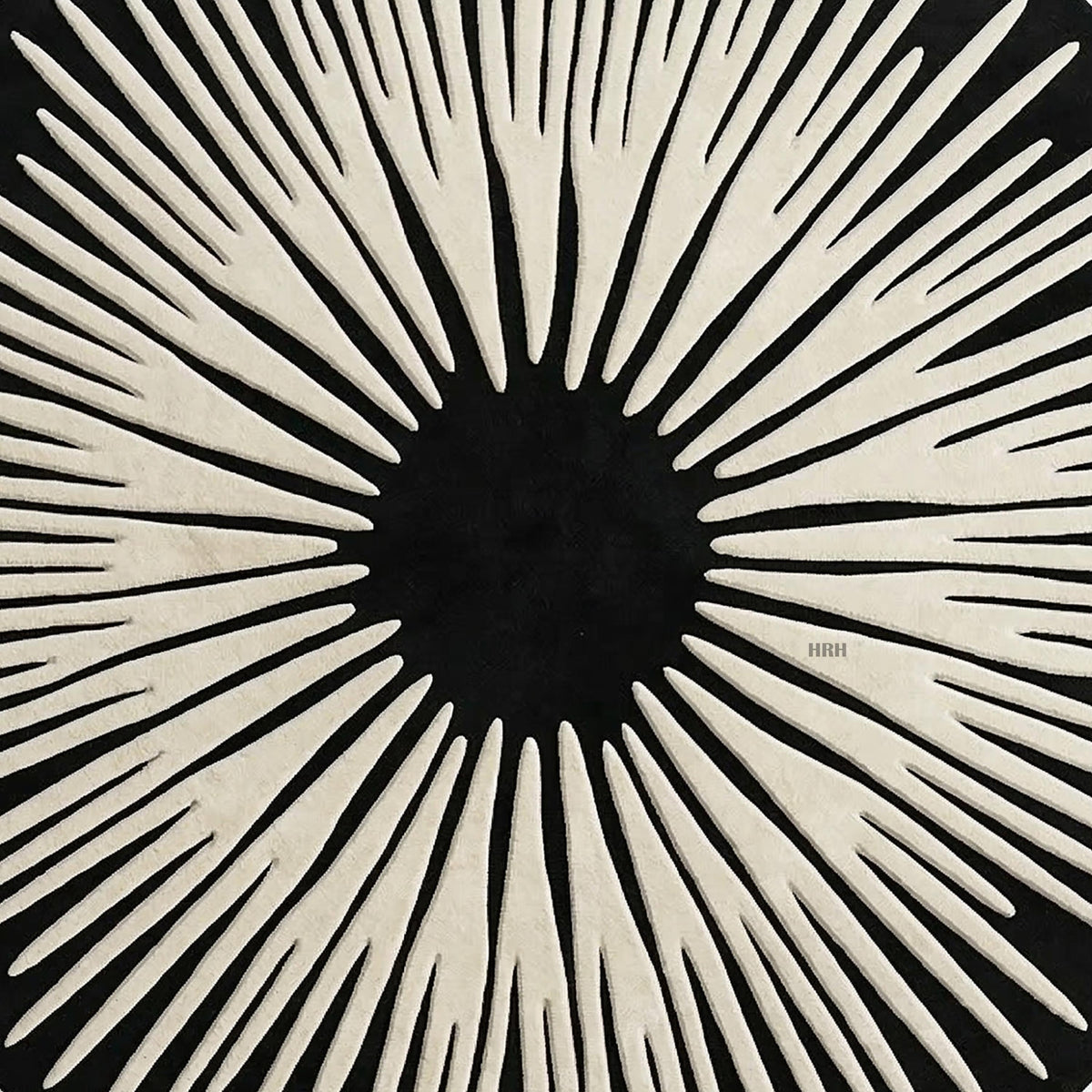 Trendy home decor showing a sun ray inspired tufted mat.

Beautifully woven round rug blending midcentury and contemporary art.

Upscale playroom interior featuring animal poufs and abstract carpet.

Bespoke floor design with radiating light and dark elements.

Handcrafted modern rug providing comfortable stylish base for furniture.