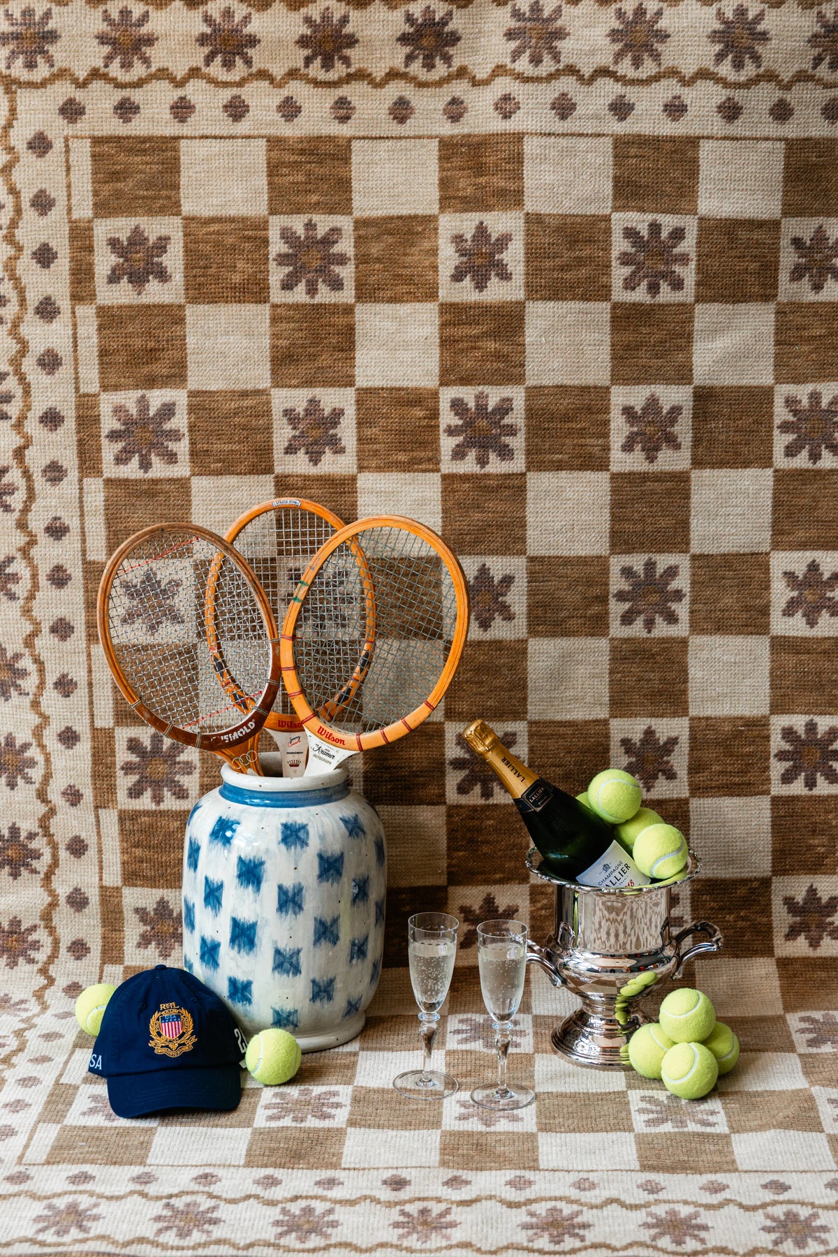 Brown and ivory Modern Oushak checkerboard floral area rug styled with tennis-inspired decor