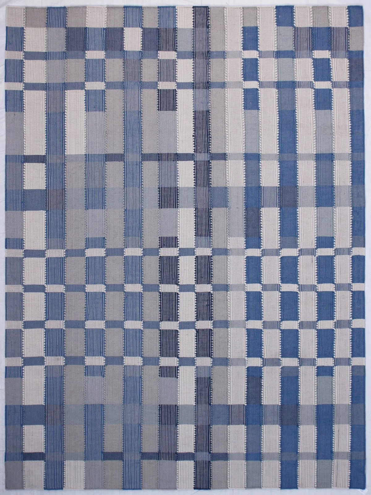 Large 9x12 blue and ivory plaid flatweave area rug with an irregular geometric grid pattern